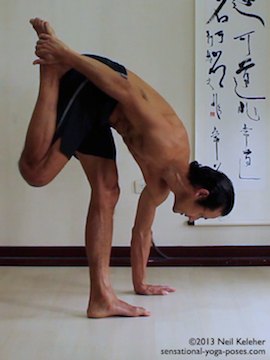 Sensational Yoga Poses, Model Neil Keleher. balancing on one leg while bend forwards with the hand grabbing the lifted ankle in this substitute for lotus pose that is similiar to the quad stretch position